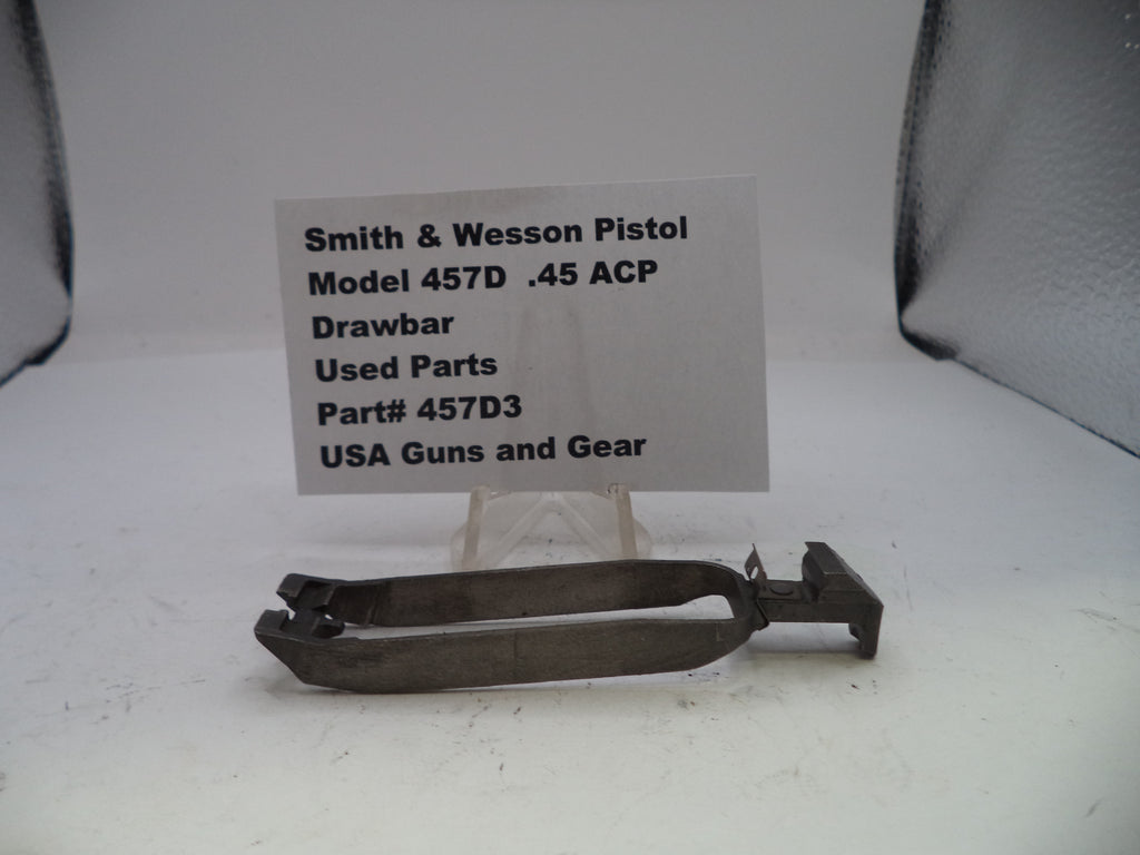 Smith & Wesson pistol drawbar part with a label on a white background