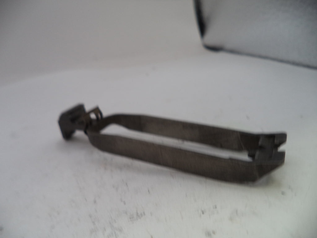 Metallic tool on a white surface