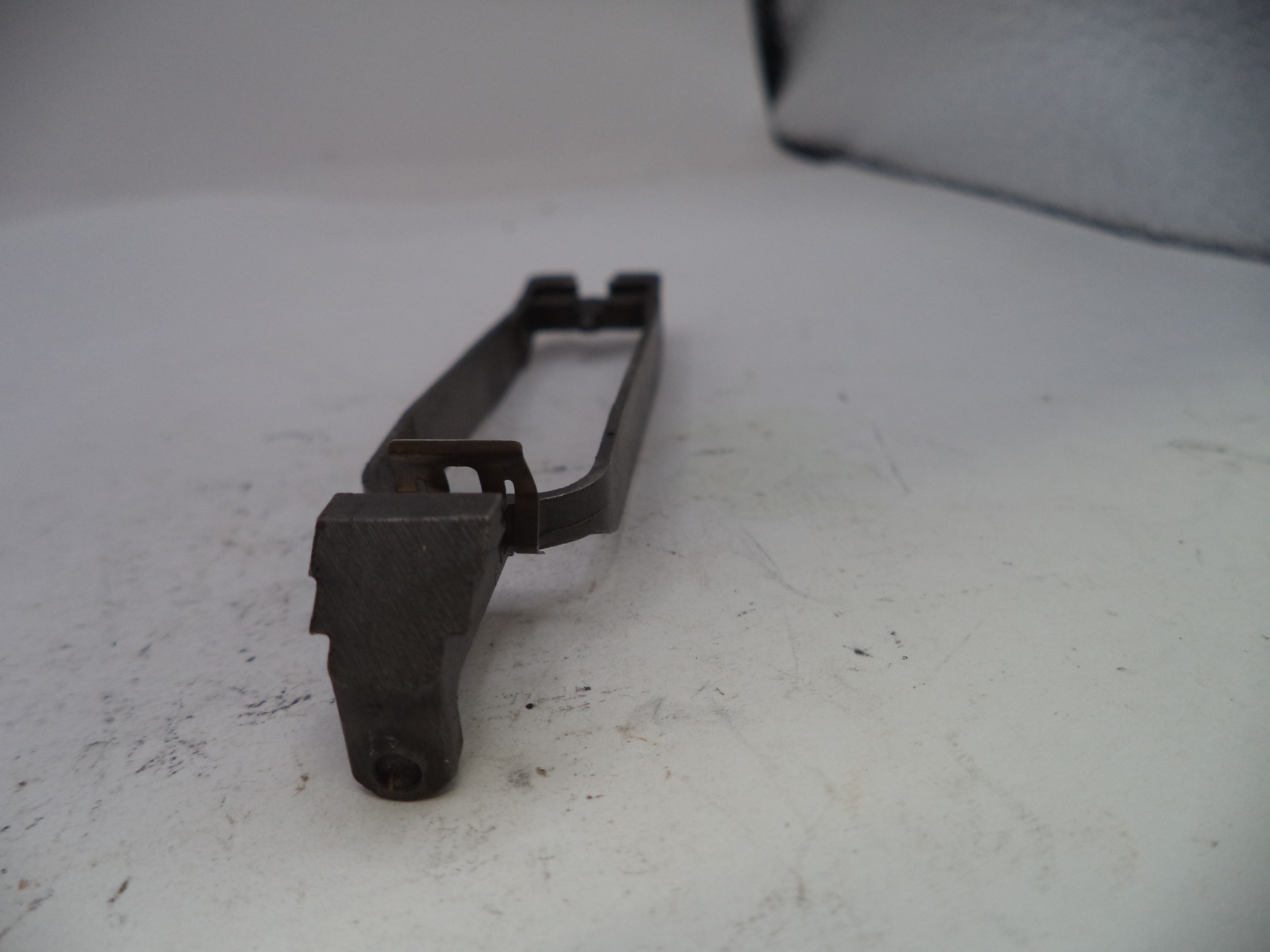 Metal component on a white surface