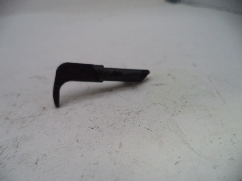 Black metal tool on a white surface