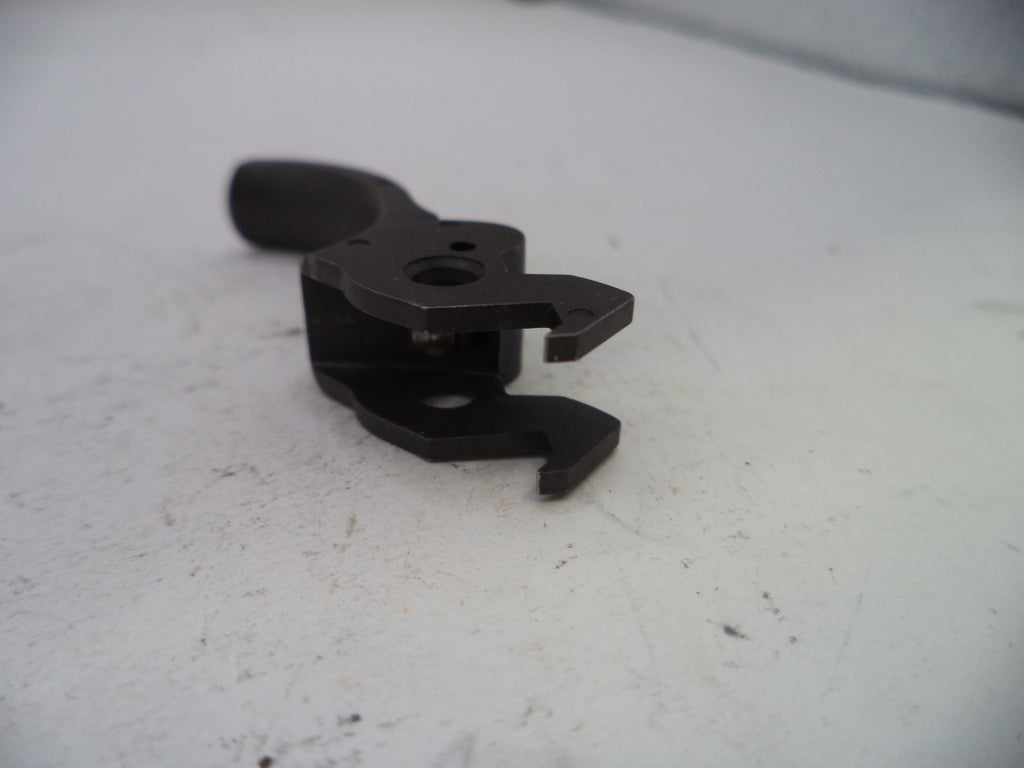 Black metal clip on a white surface