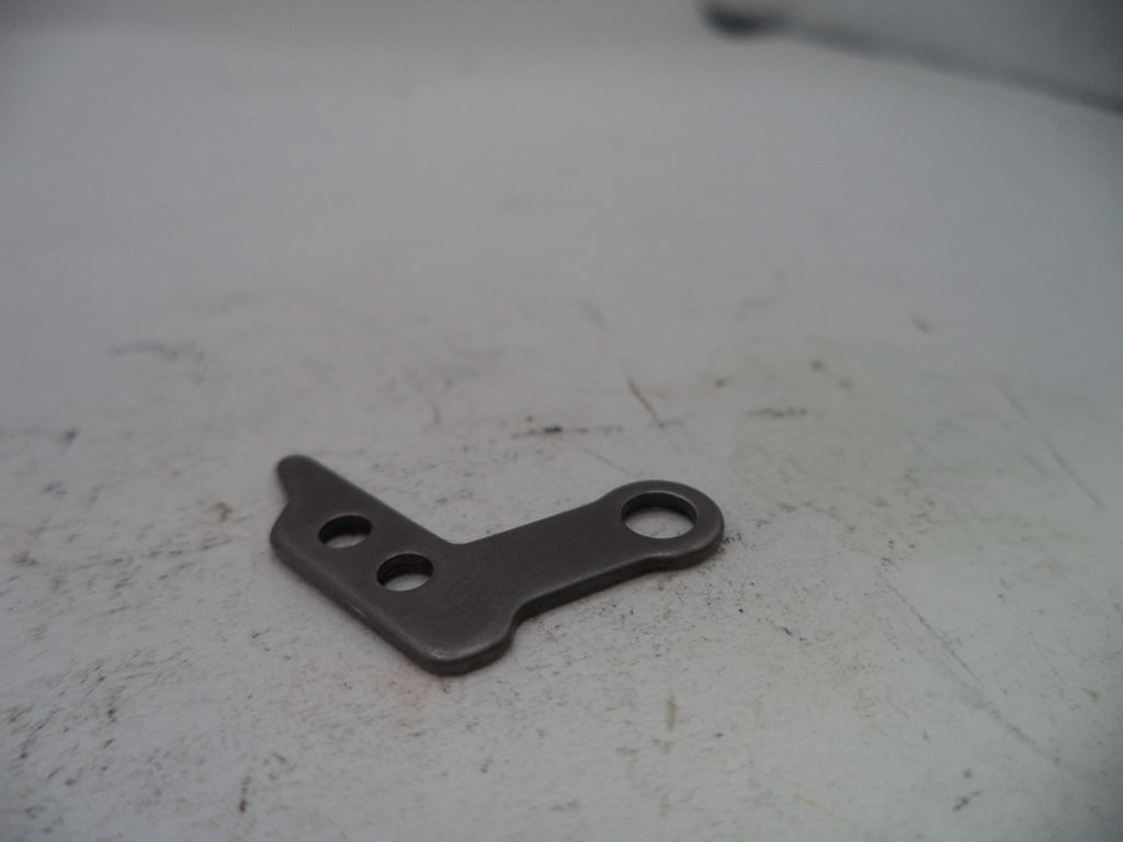 Metal bracket on a textured white surface