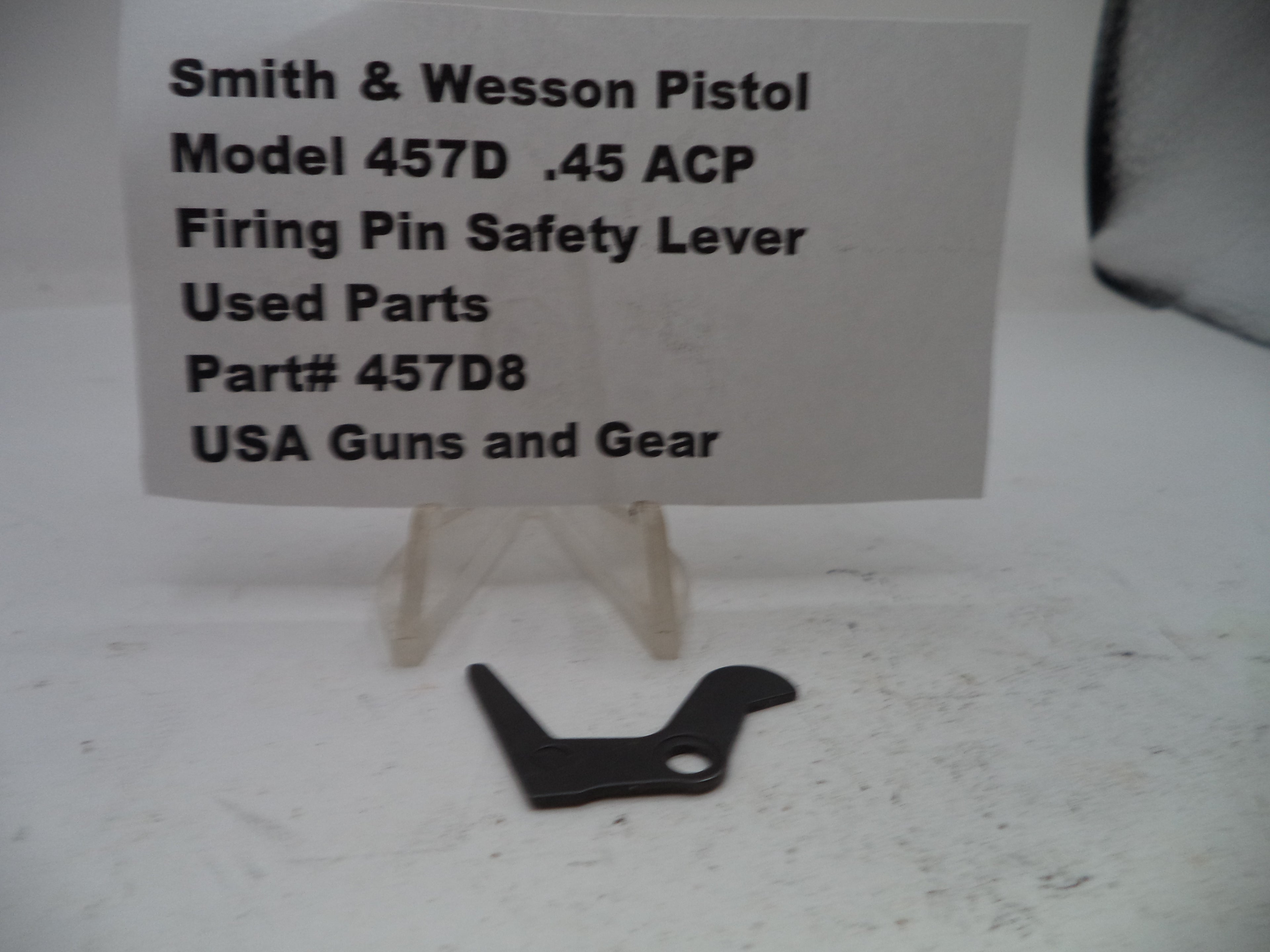 Black firing pin safety lever for Smith & Wesson Pistol Model 457D on a white background with text label.