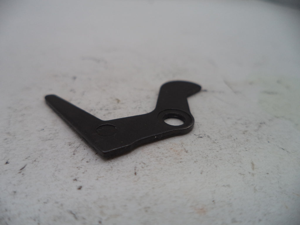 Black metal bracket on a textured white surface