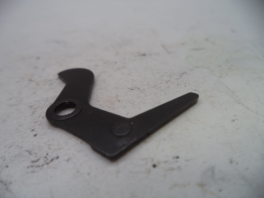Black metal tool on a white surface