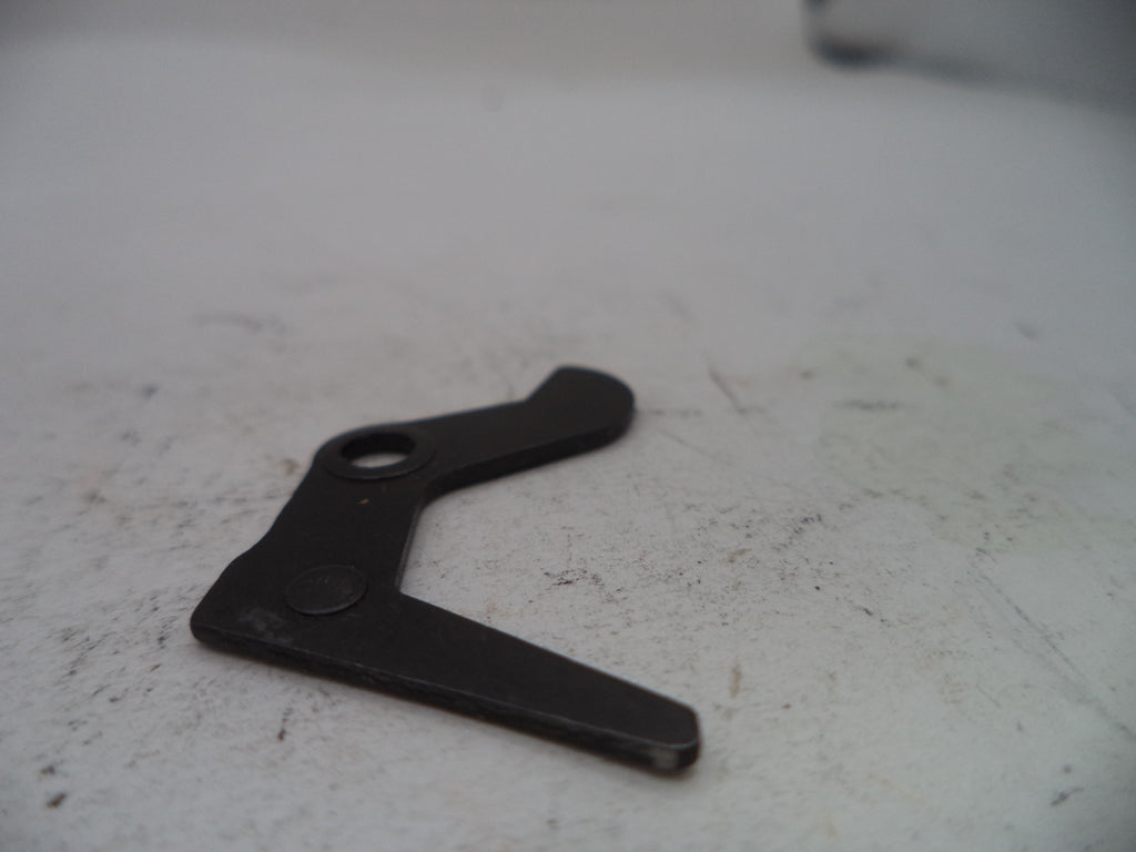 Black metal bracket on a white surface