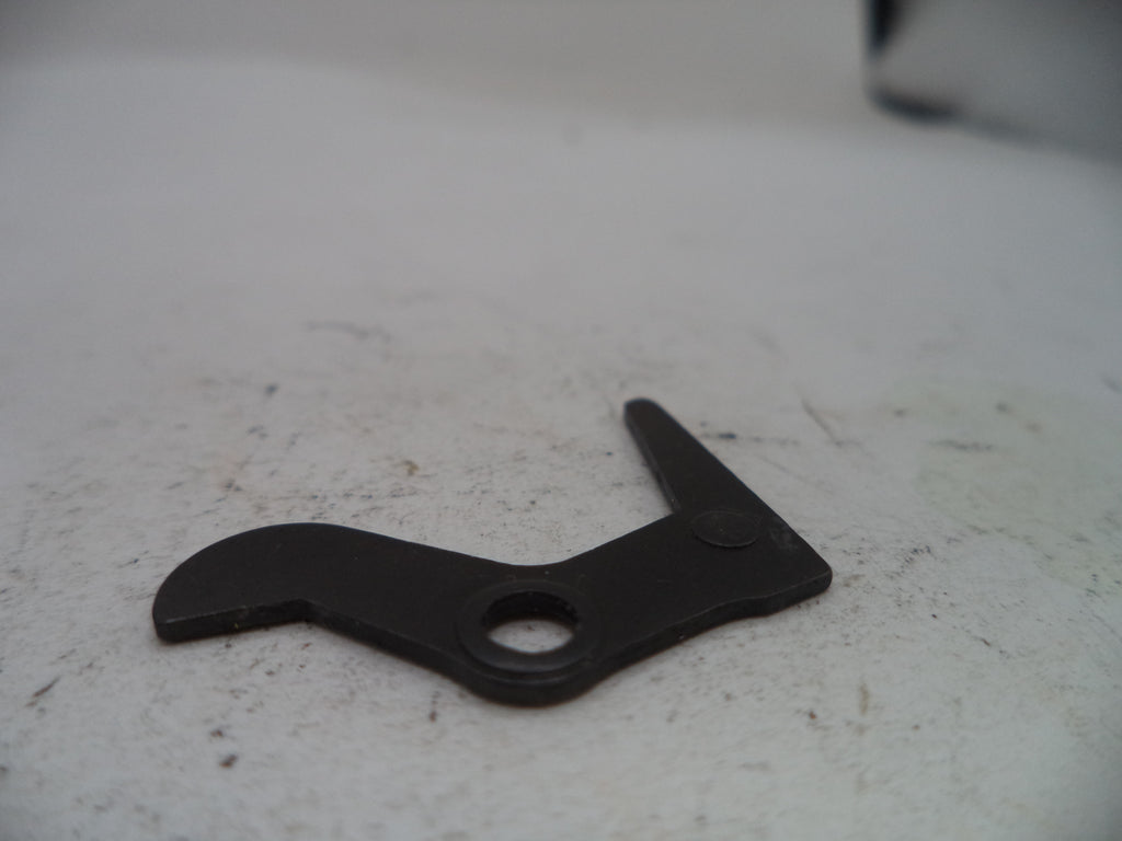 Black metal lever on a textured white surface