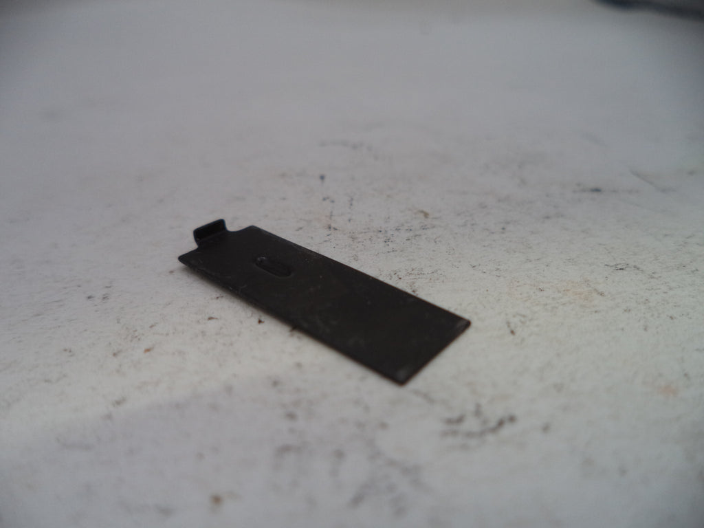 Black metal bracket on a white surface