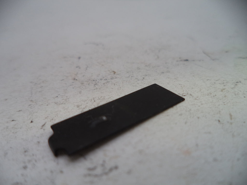Black rectangular object on a light-colored surface