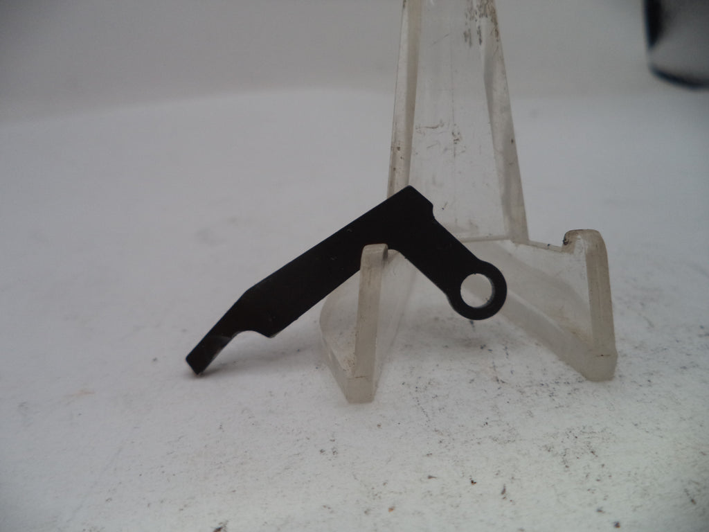 Black metal bracket on a white stand with a white background