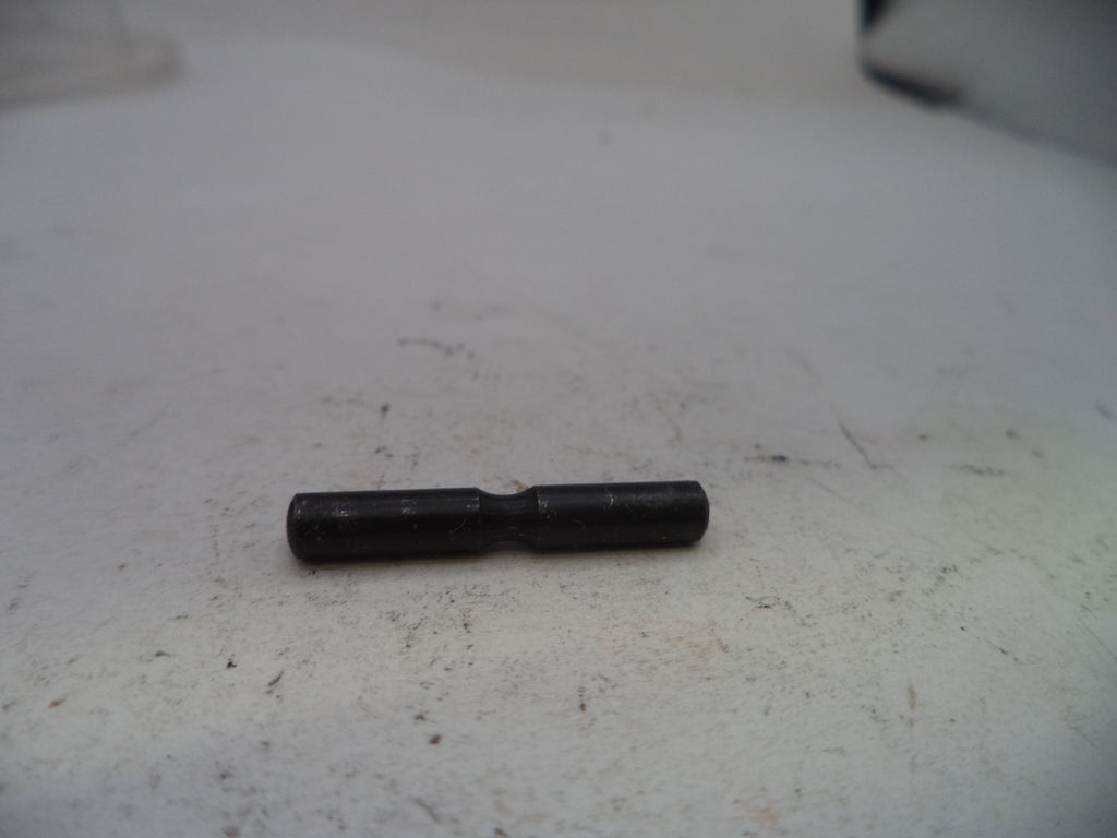 Black cylindrical object on a white surface