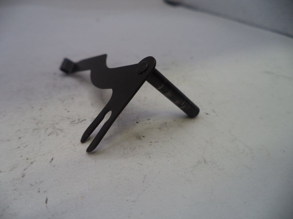 Black metal tool on a white surface