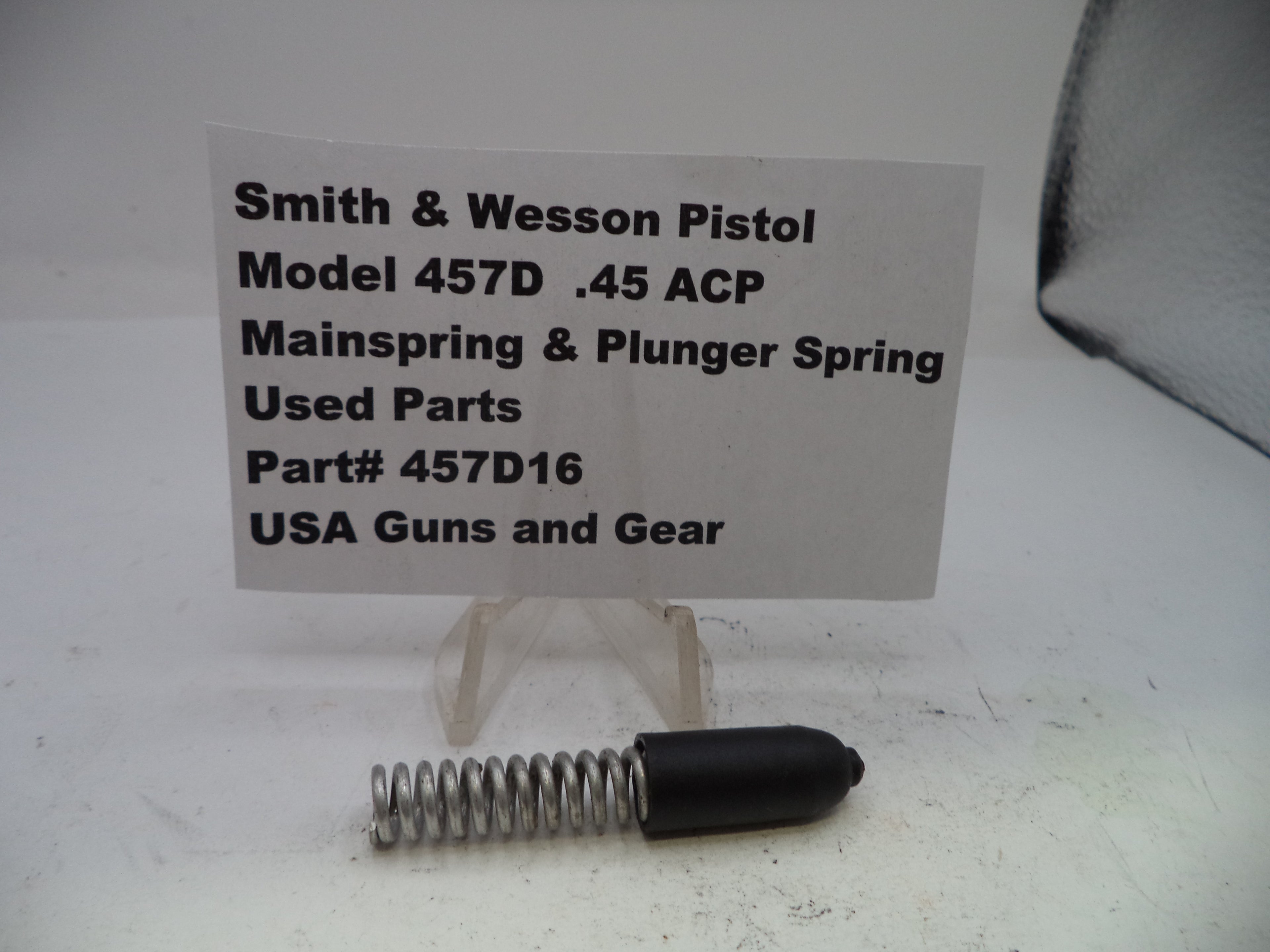 Smith & Wesson pistol mainspring and plunger spring with a label on a white background