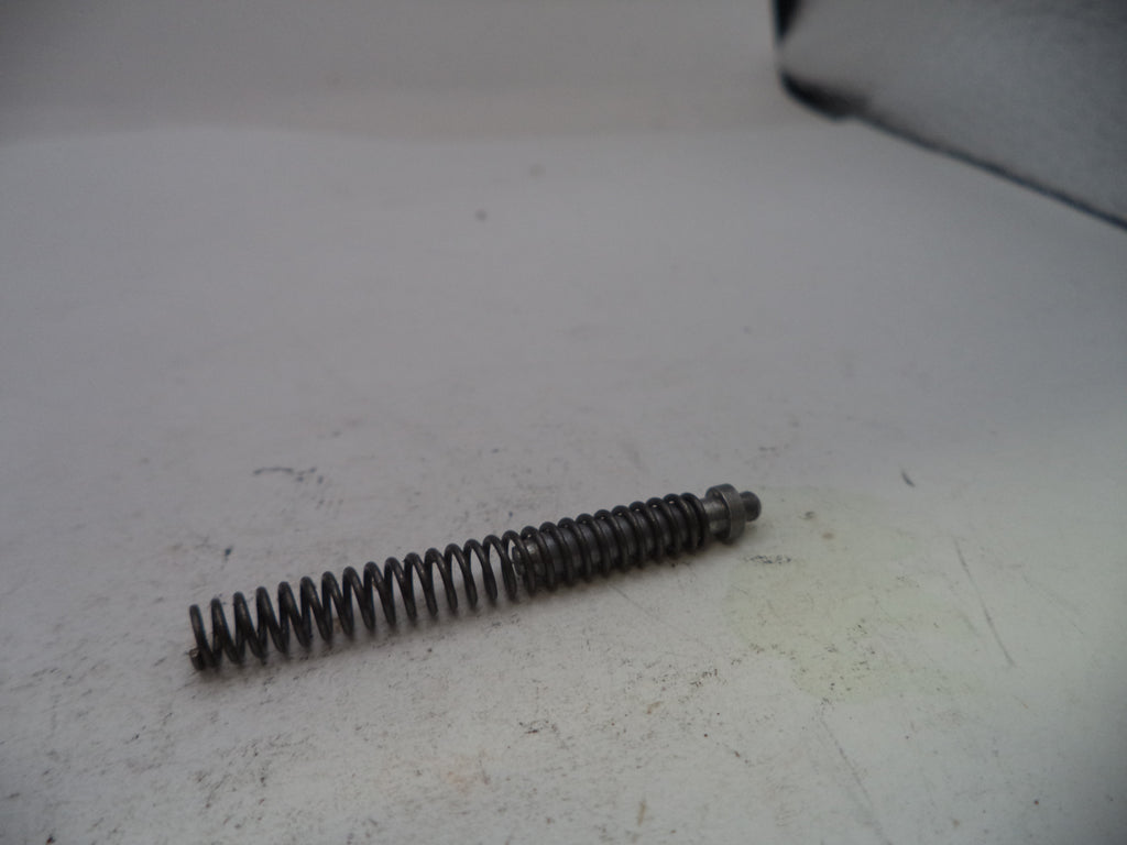 Coiled spring on a white surface