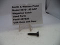 Magazine catch for Smith & Wesson Pistol Model 457D .45 ACP on a white background with a label.