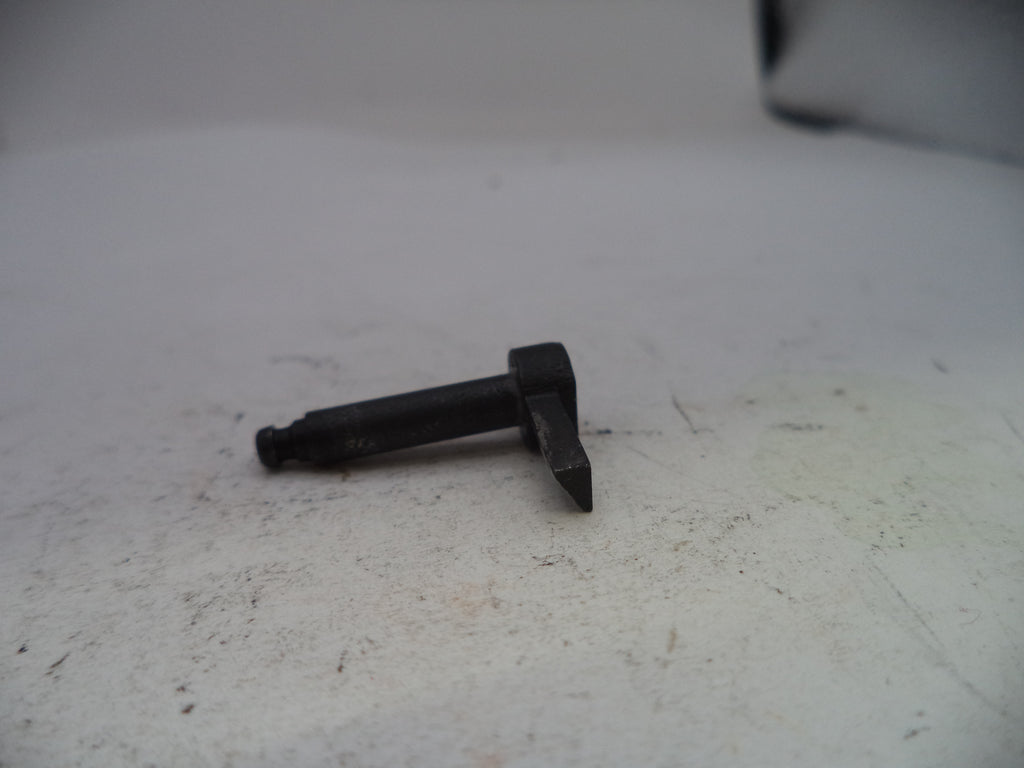 Black metal bolt on a white surface