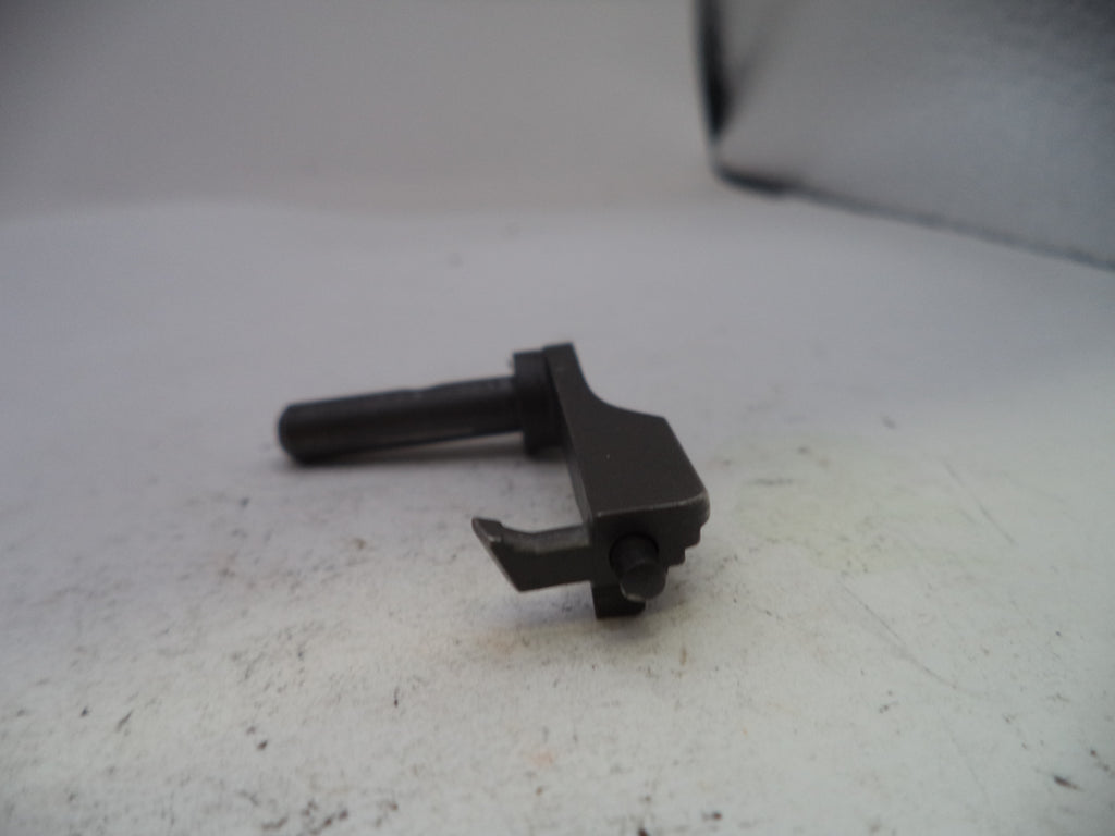 Small black metal component on a white surface