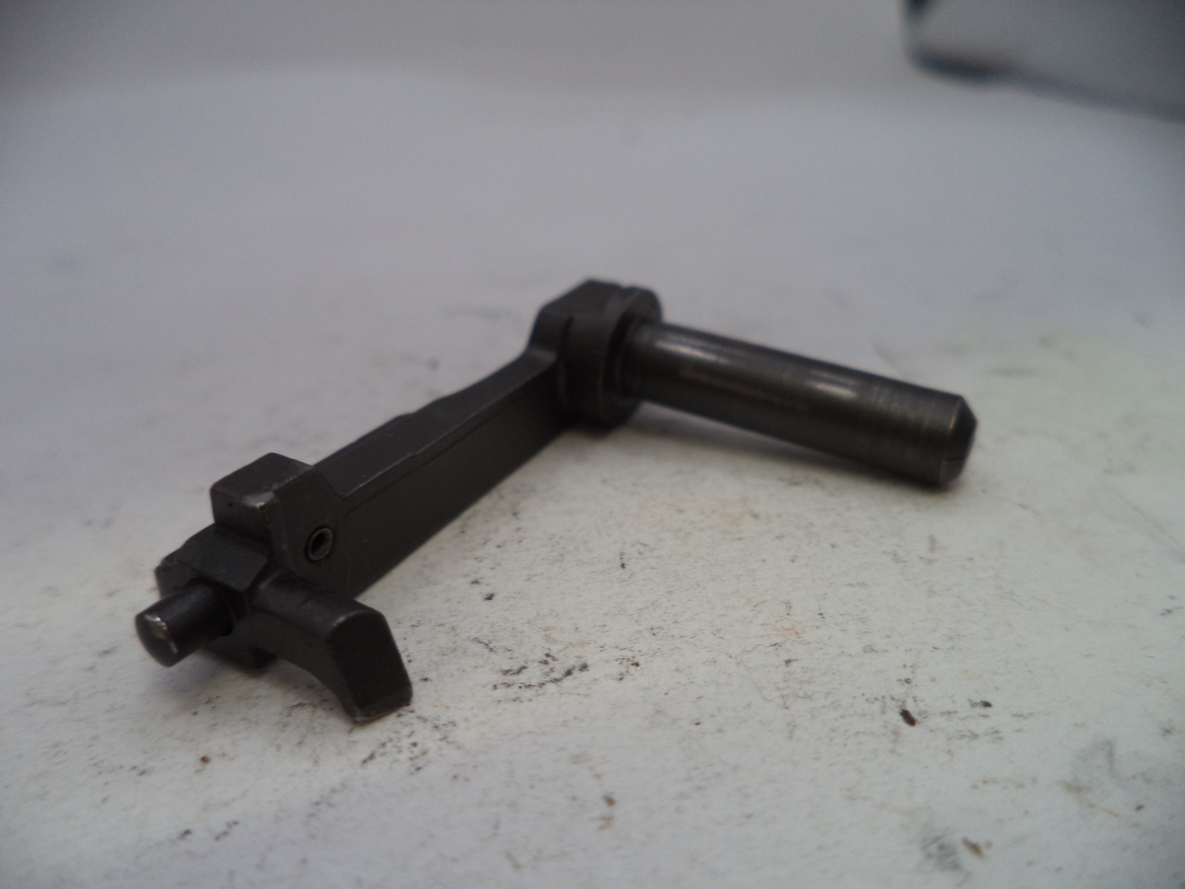 Black ignition coil on a white surface