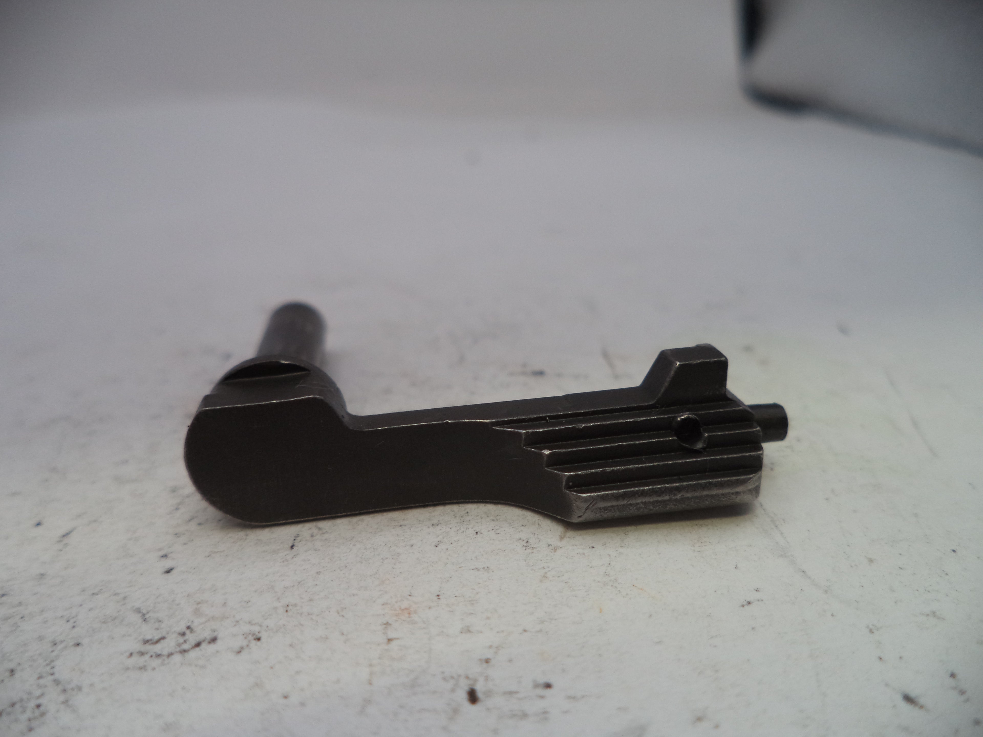 Black metal mechanical component on a white surface