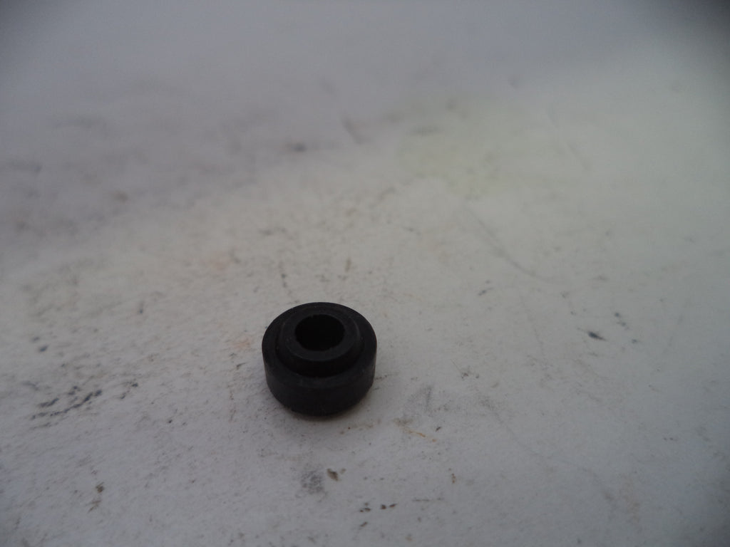 Black rubber bushing on a white surface