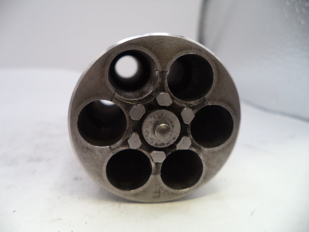 Metallic revolver cylinder on a white background