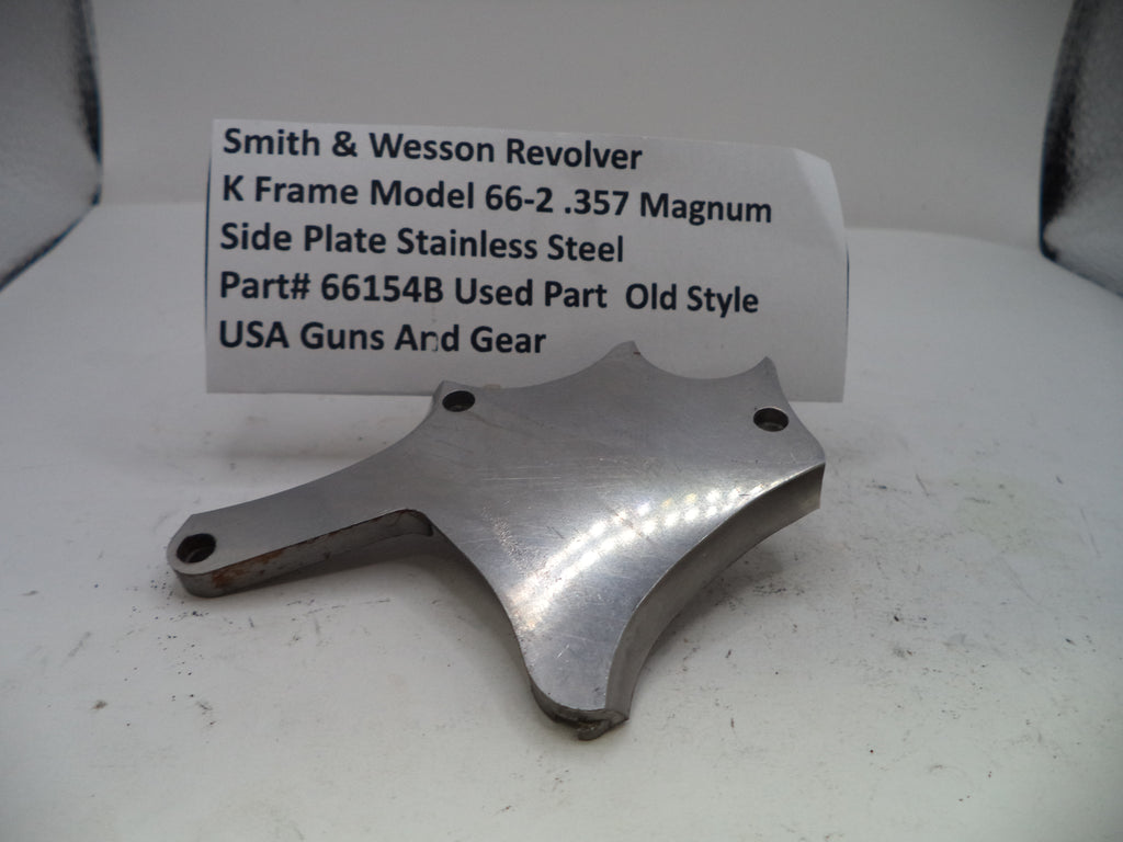 Metal side plate for a Smith & Wesson revolver with descriptive label on a white background