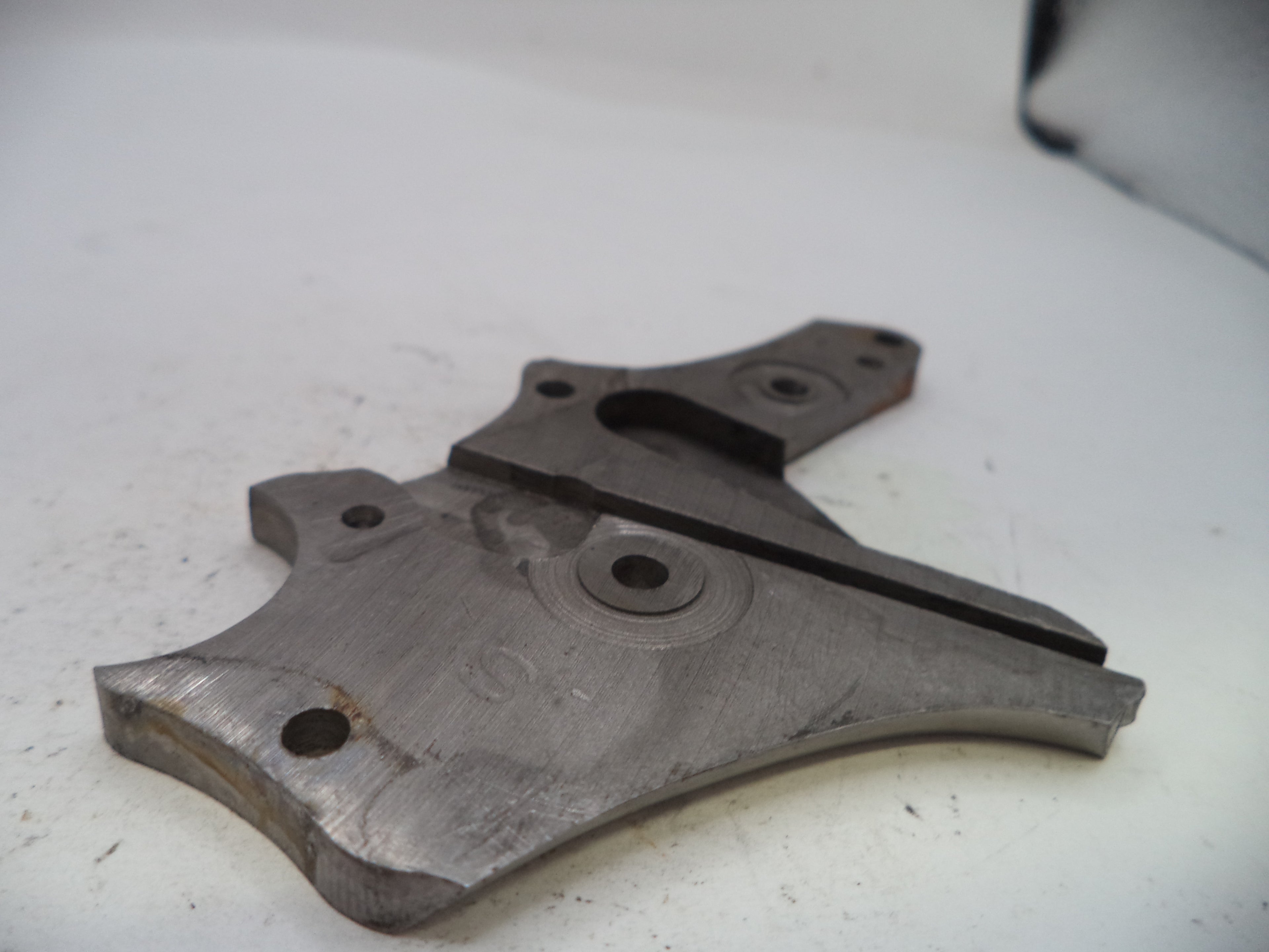 Metal mechanical component on a white surface