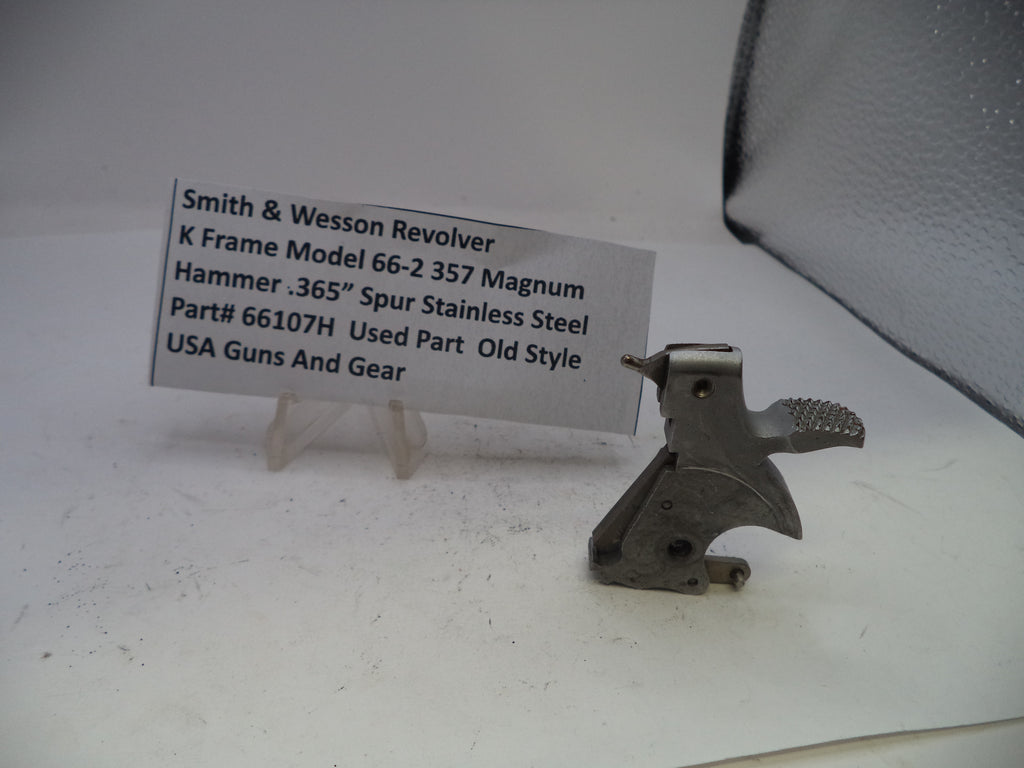 Smith & Wesson revolver part on a white surface with a label
