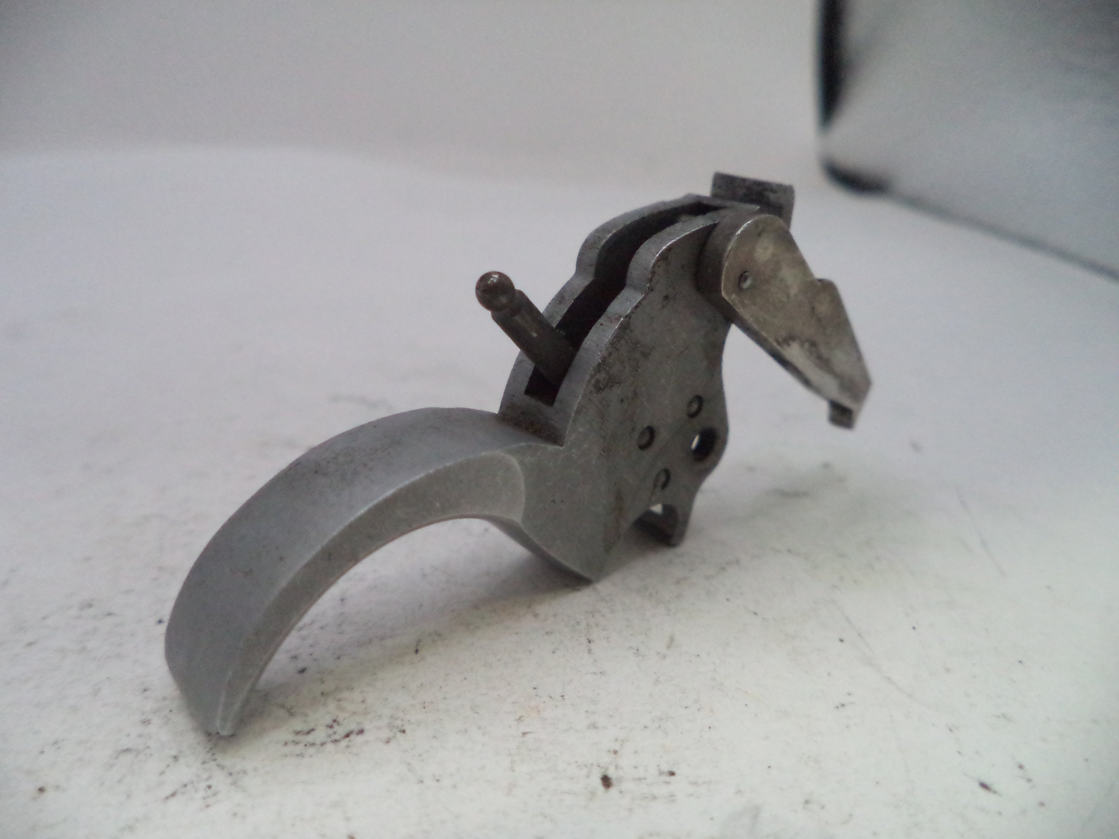 Metal tool or component on a white background