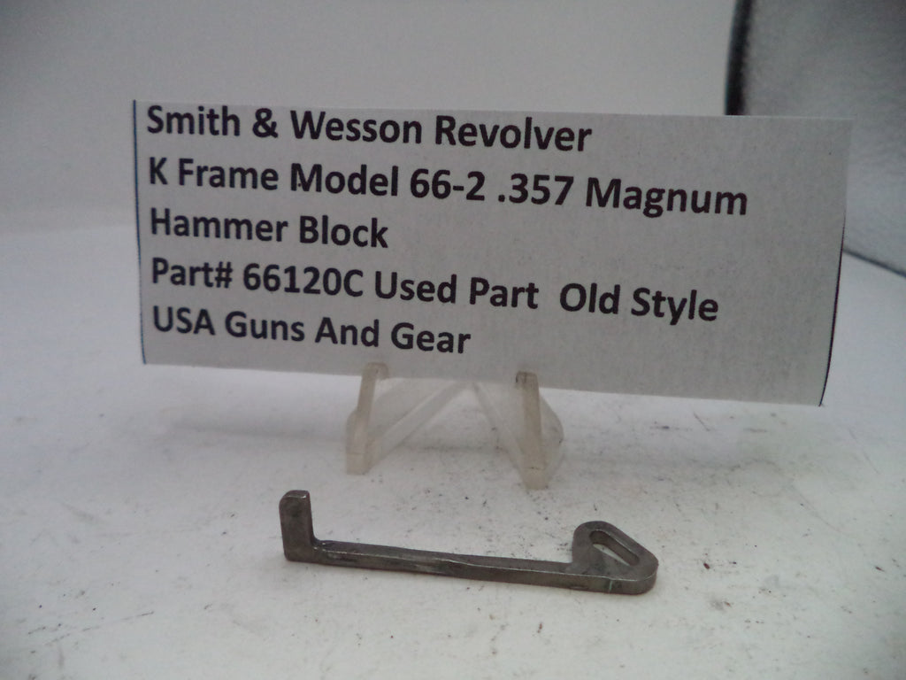 Smith & Wesson revolver hammer block part on a white background with a label.