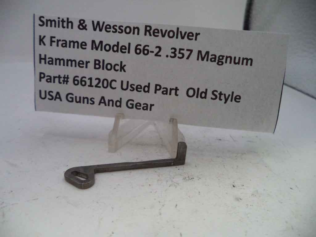 Smith & Wesson revolver hammer block on a stand with a label