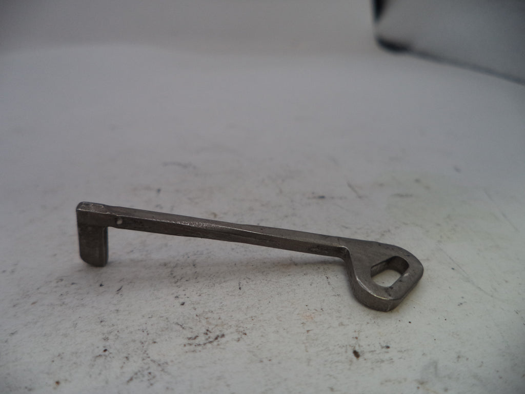 Metal key on a textured white surface