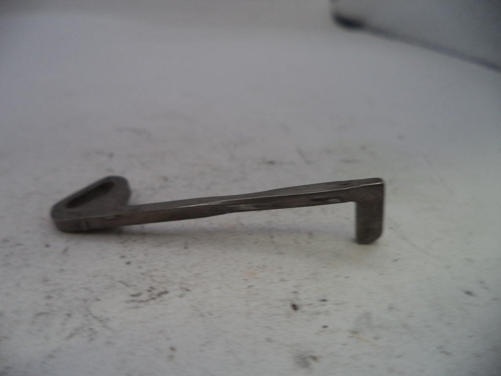 Metal key on a white surface