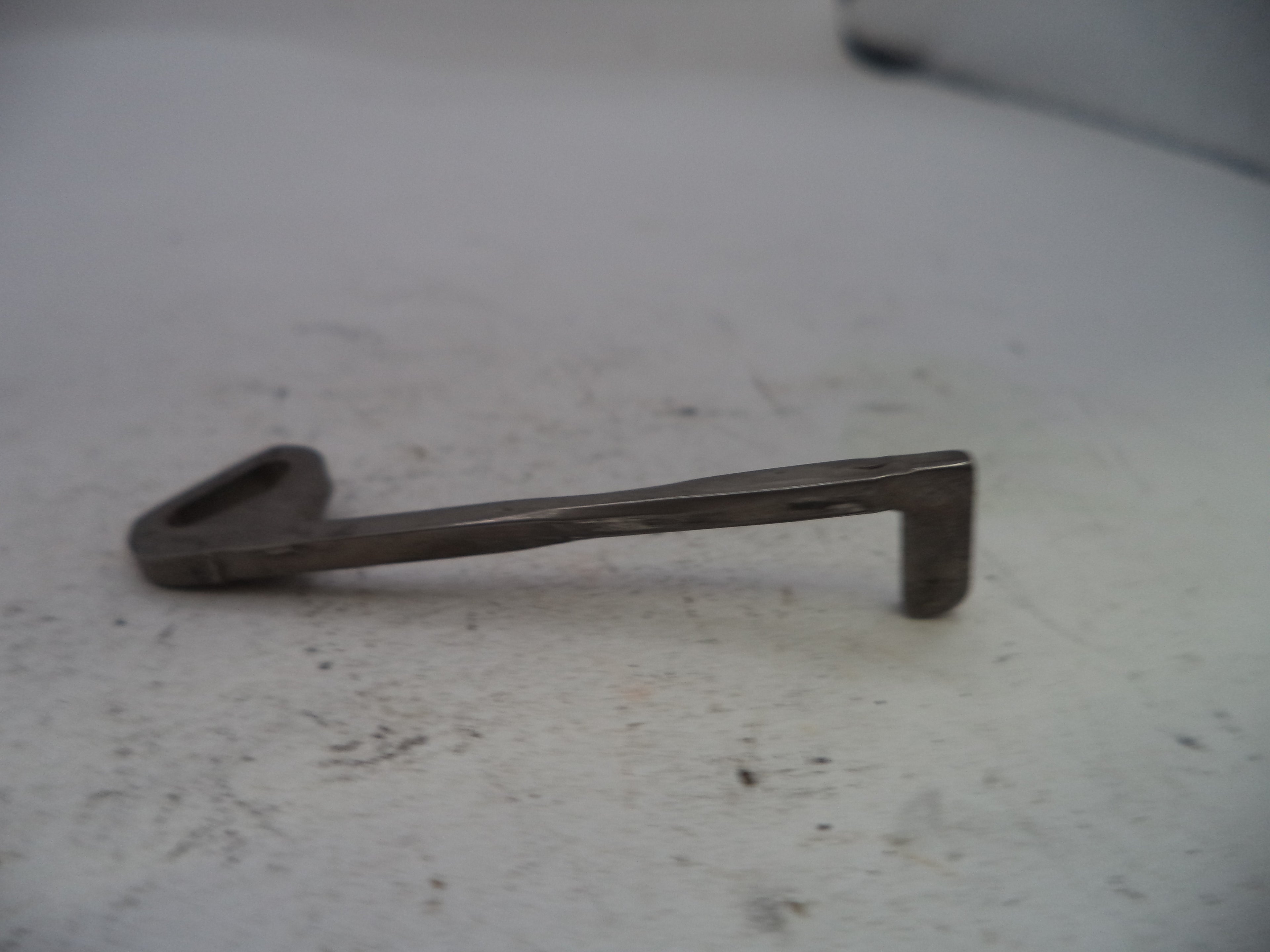 Metal key on a white surface