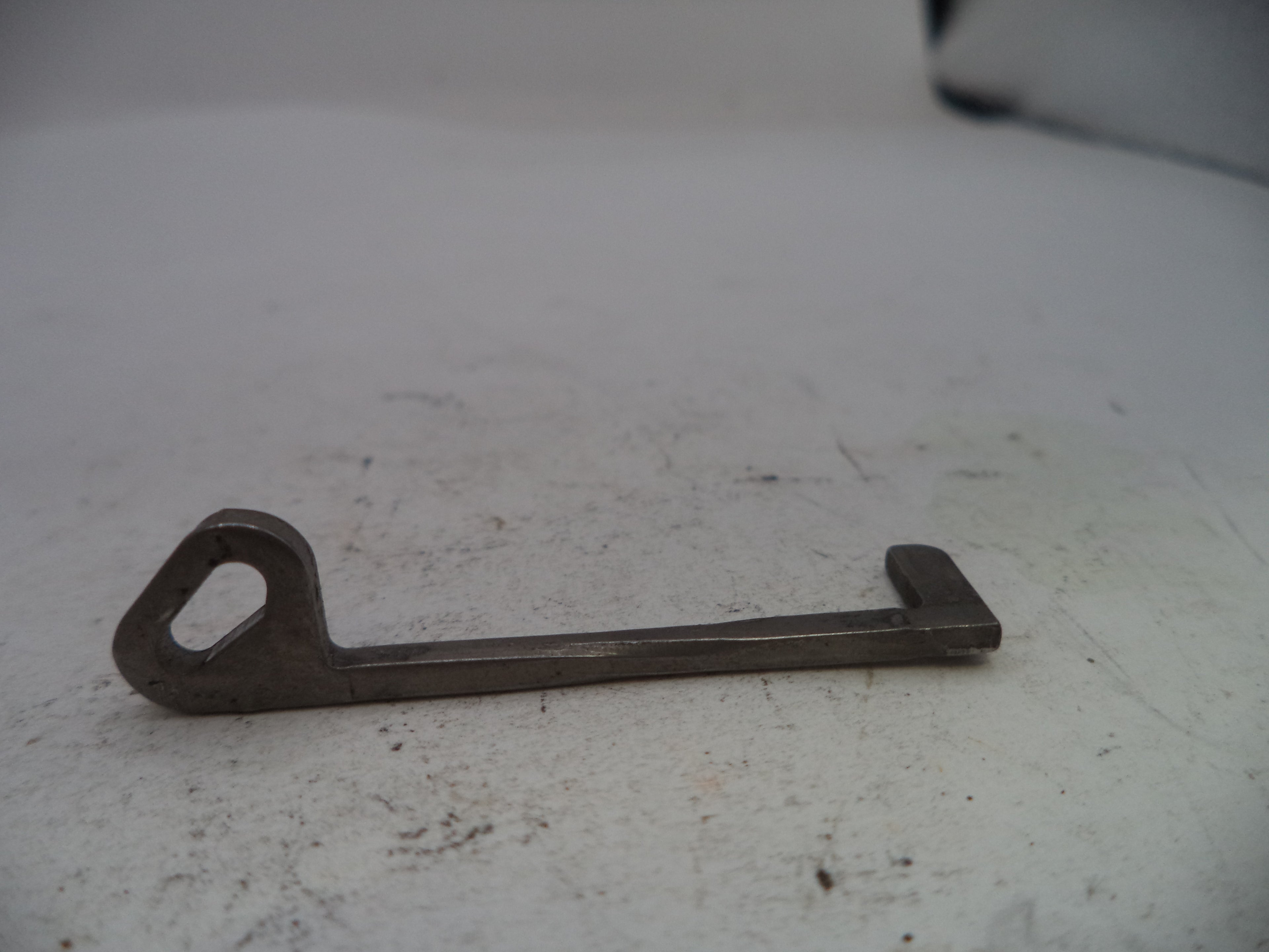 Metal key on a white surface