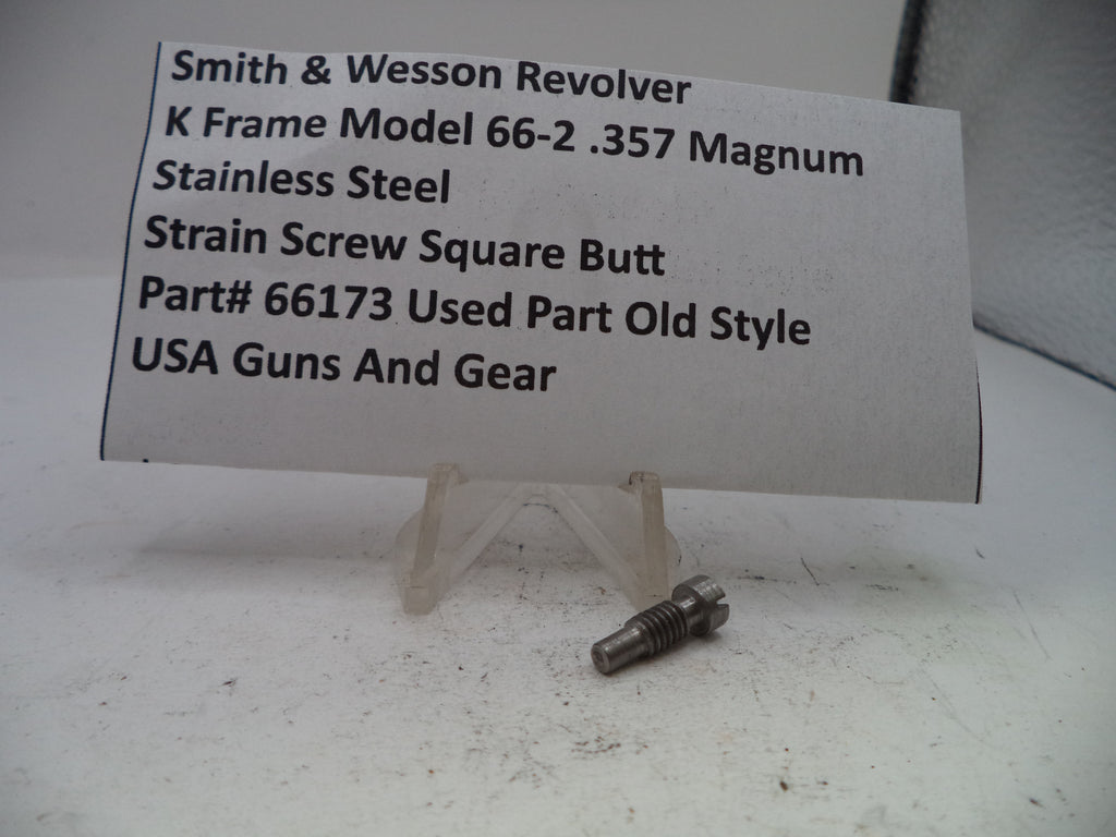 Small metal screw with descriptive card on a white background