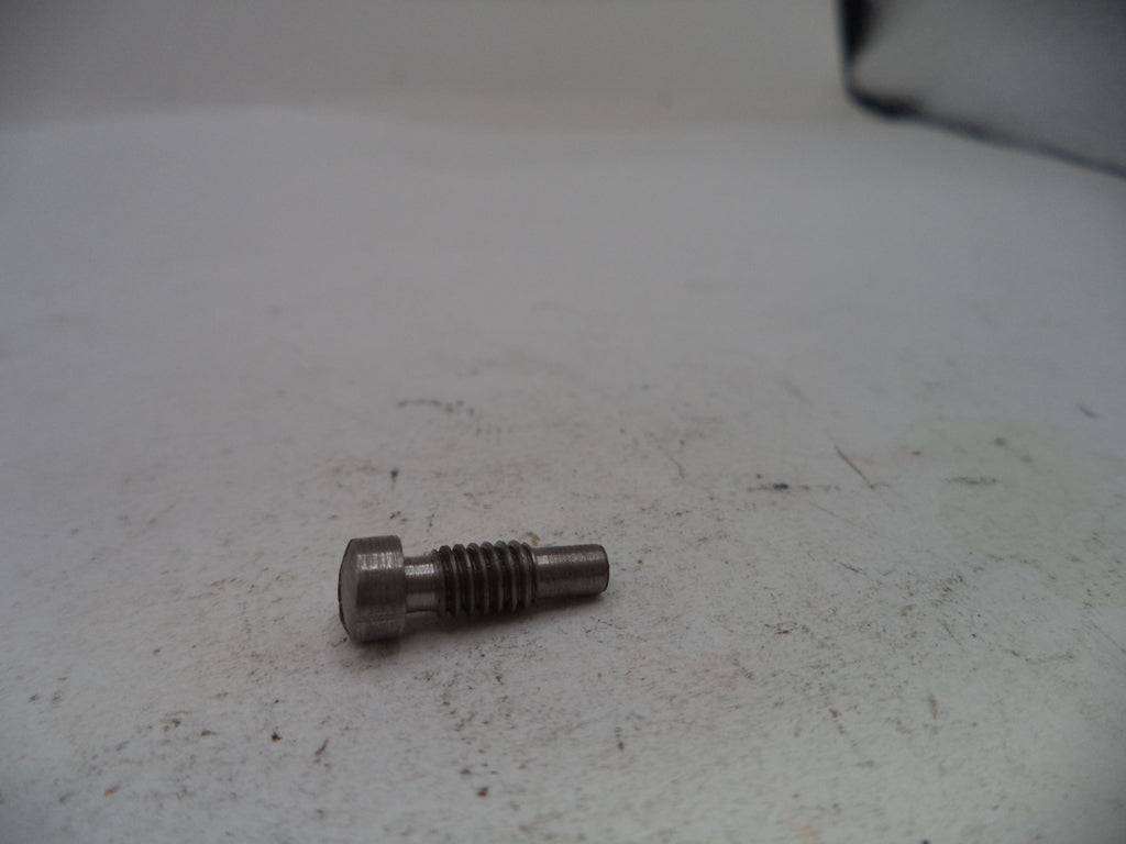 Metal bolt on a textured white surface