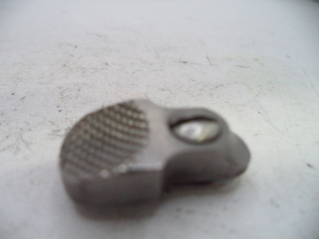 Small metallic object on a white surface