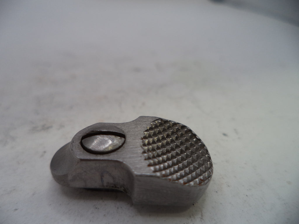 Metallic object with textured surface on a light gray background