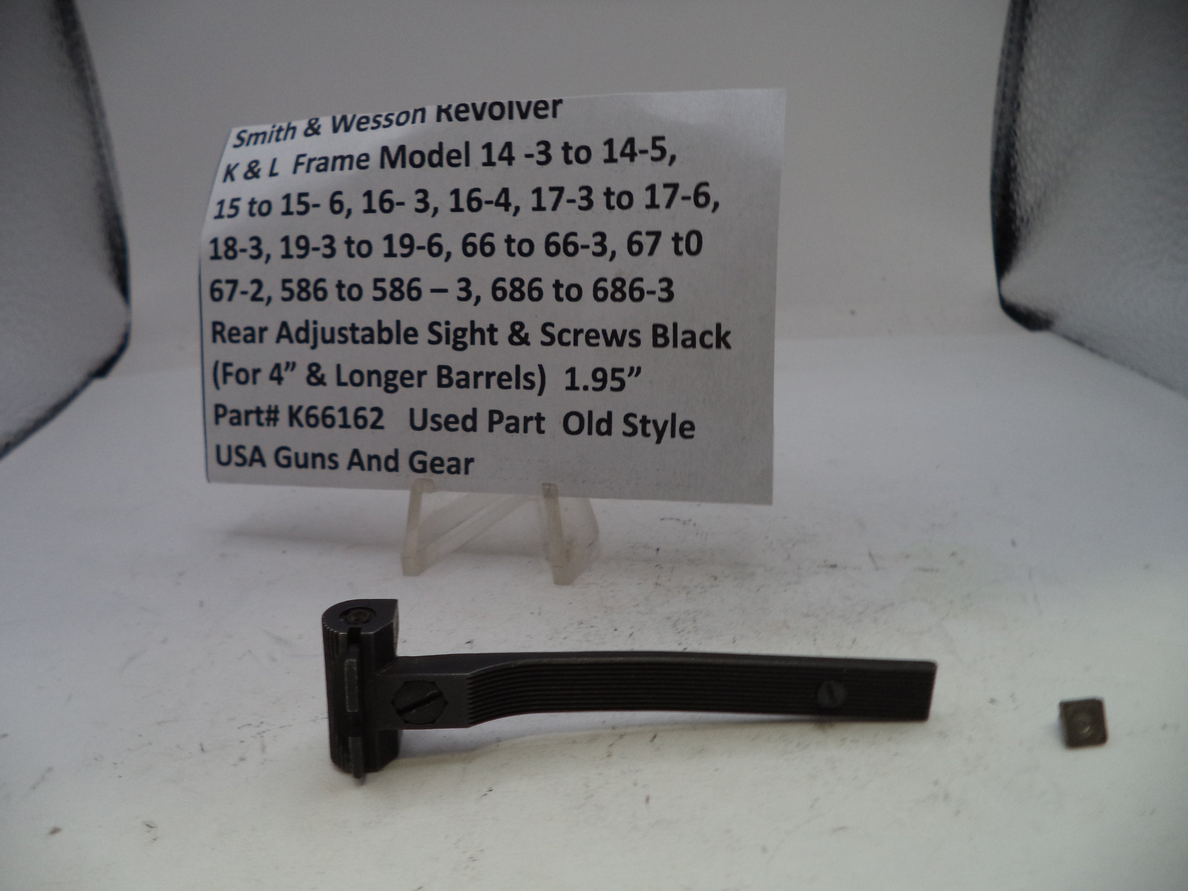 Black revolver part with descriptive label on a white background