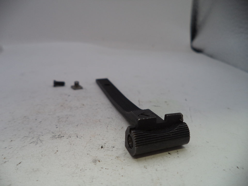 Black mechanical component on a white surface