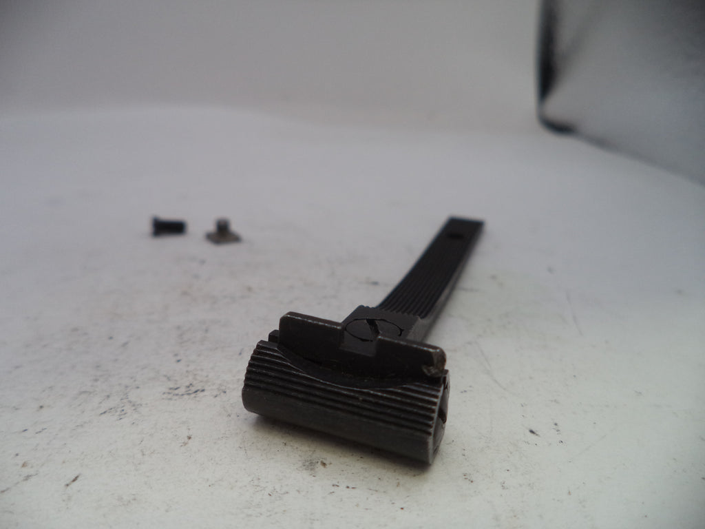 Black metal component on a white surface