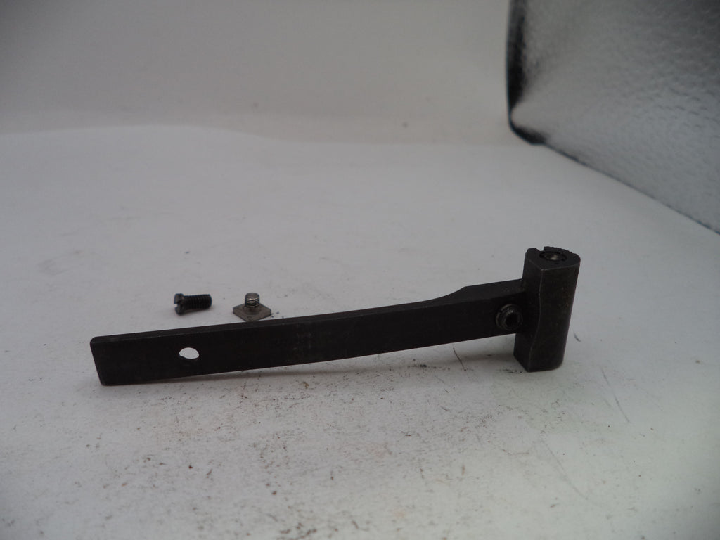 Black metal bracket with screws on a white surface