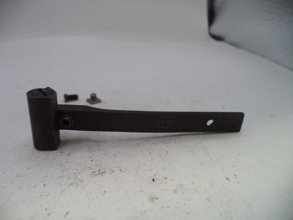 Black metal bracket with screws on a white surface
