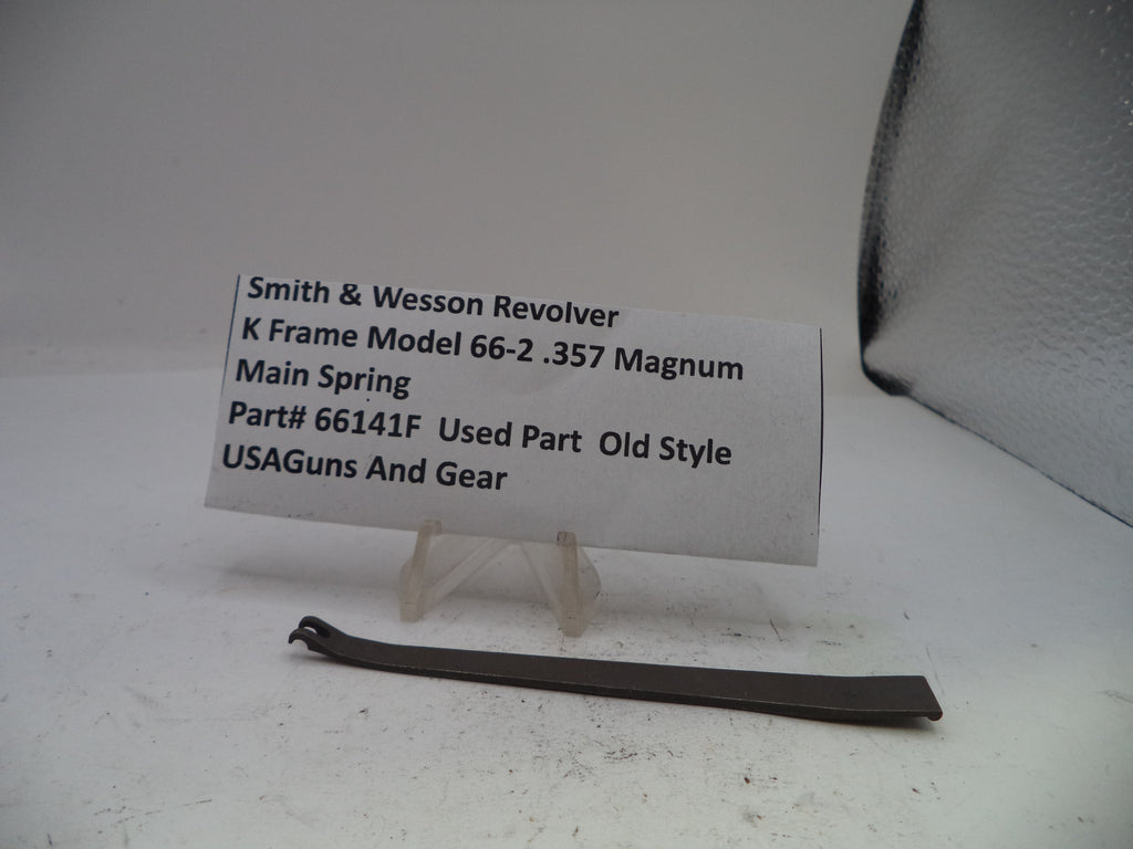 Smith & Wesson revolver main spring with a label on a white background
