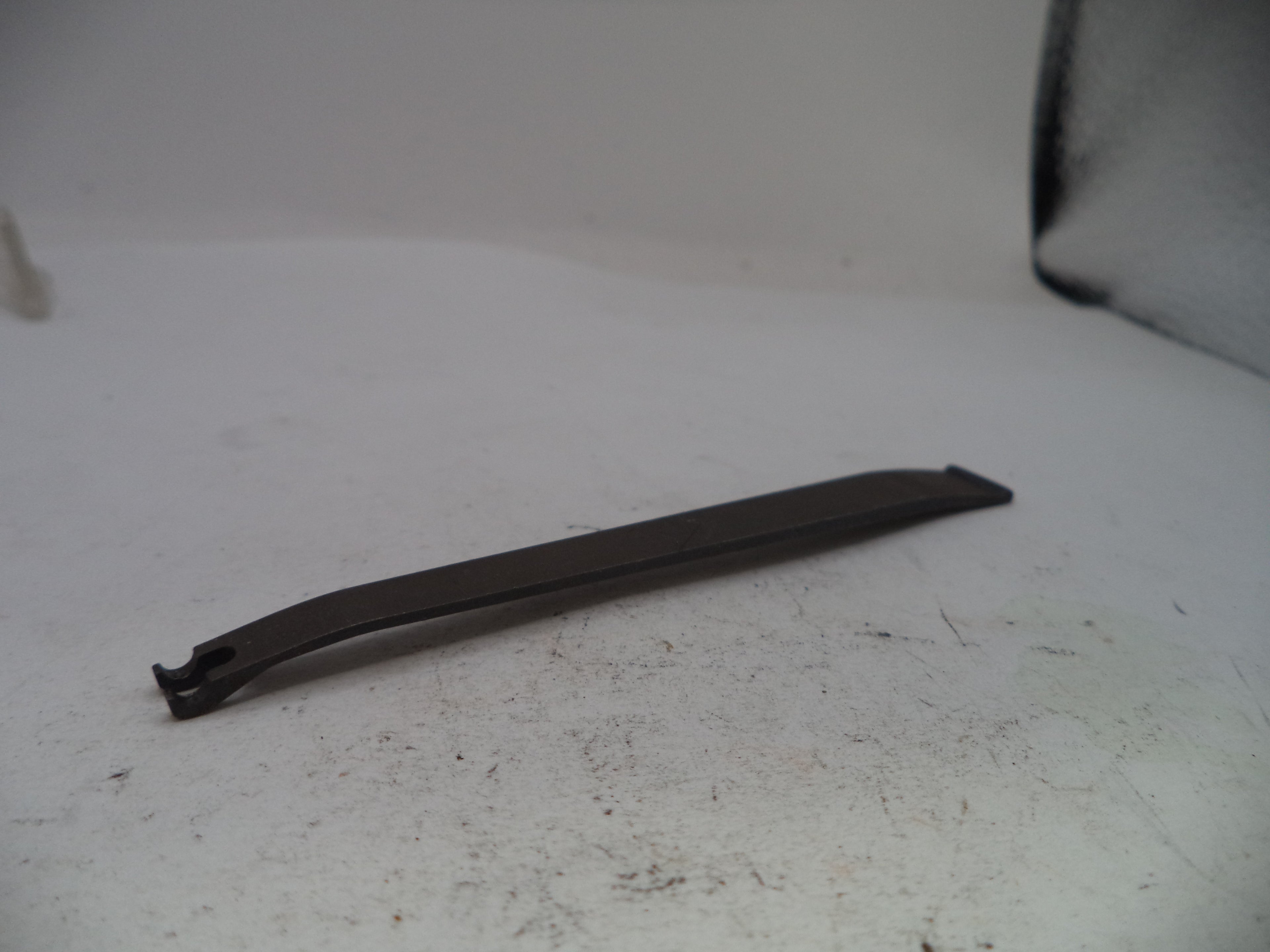 Black rubber strip on a white surface