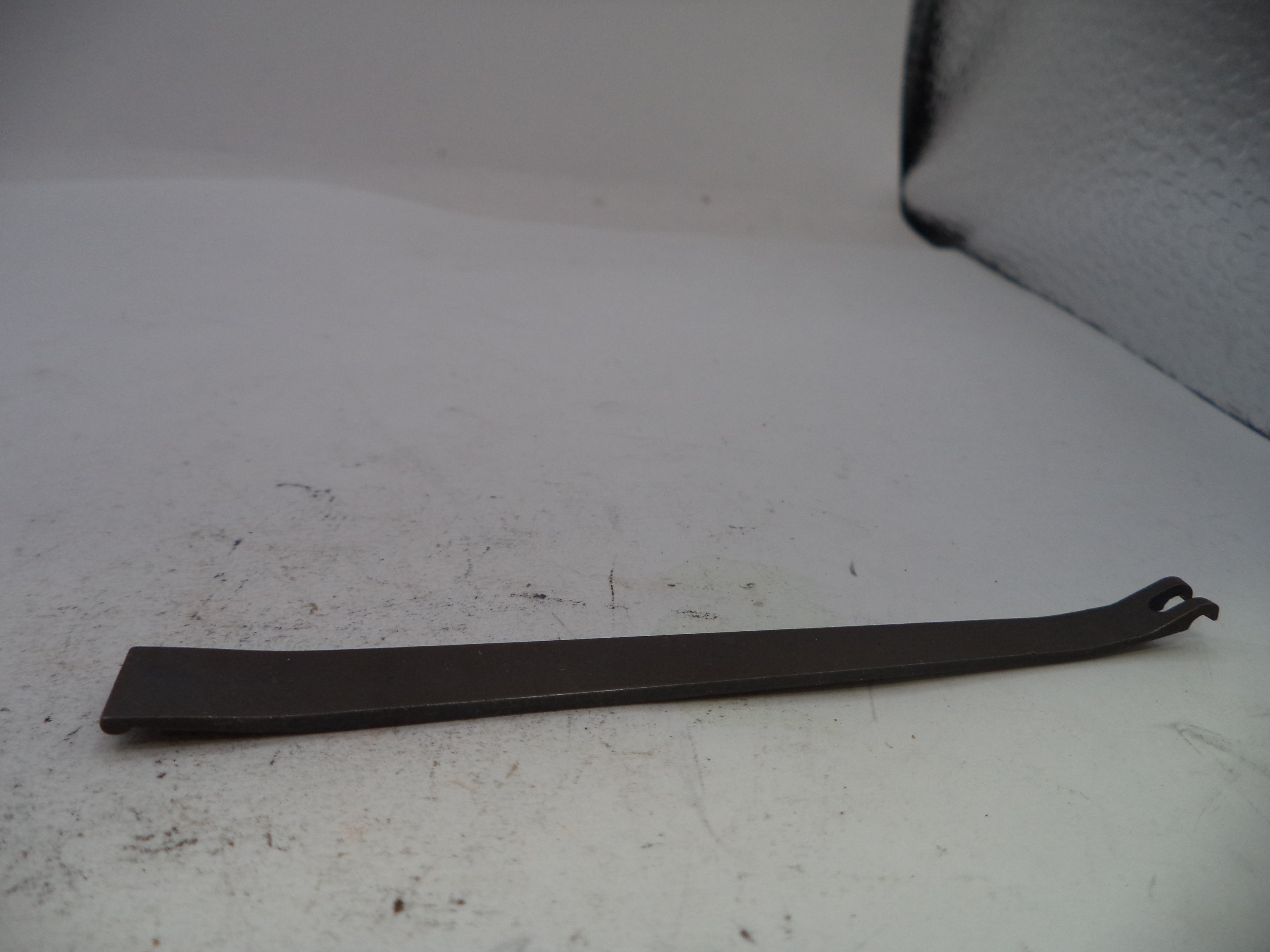 Metal pry bar on a white surface