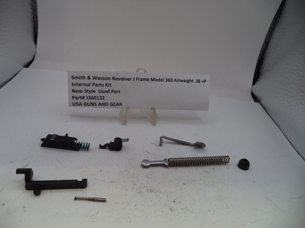 Smith & Wesson Revolver J Frame Model 360 Airweight internal parts kit, part number J360132, displayed on a white surface with a small label card. The kit contains various black and silver metal components including a spring, lever, screws, and a black receiver assembly.