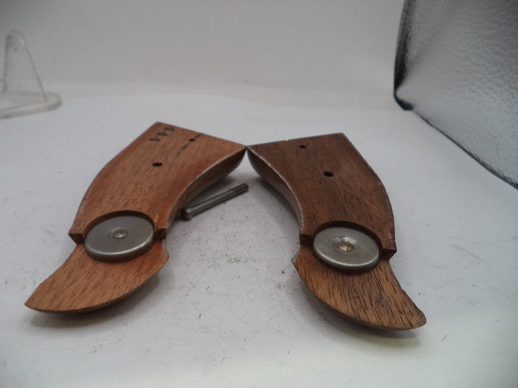 Two wooden knife handles with metal magnetic closures, shown on a white surface.