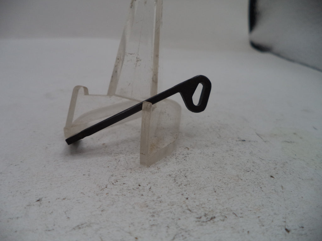 A single black metal key or lock pick with a looped end, displayed on a clear plastic stand against a light gray background.